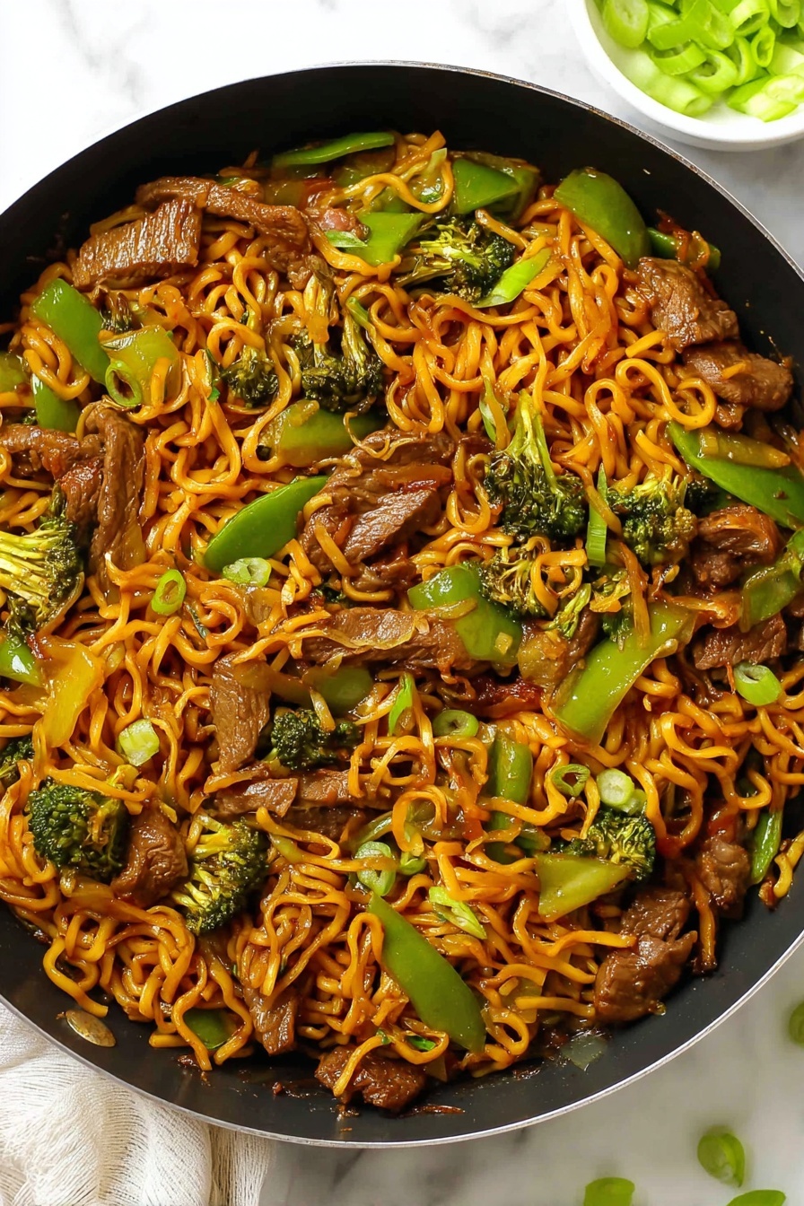 Sticky Beef & Noodles, one pan beef and noodle stir-fry, easy beef noodle recipe, quick weeknight dinner ideas, flavorful beef noodle dish - The image shows a black pan filled with stir-fried noodles layered evenly throughout, with an orange-brown sauce coating the spiraled noodles. On top and mixed in, there are medium-sized pieces of cooked beef with a browned texture, bright green bell pepper slices, and green broccoli florets. The noodles and vegetables are evenly spread, creating a colorful mix of orange, green, and brown in the pan. The pan is set on a white marbled surface with a small white bowl partially visible in the corner, holding sliced green onions. Photo taken with an iphone --ar 2:3 --v 7