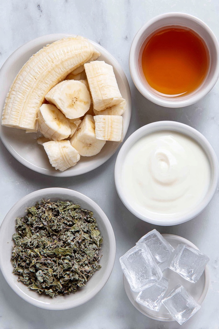 Banana Chamomile Tea Smoothie, calming fruit smoothies, healthy calming drinks, easy smoothies with chamomile, soothing banana smoothies - Flat lay of a peeled ripe banana broken into chunks, a small white bowl of brewed chamomile tea, a small white bowl of honey, a small white bowl of fresh milk, a few clear ice cubes arranged neatly, and a small white bowl with dried chamomile leaves for garnish, all placed in perfect symmetry on simple white ceramic dishes, placed on a clean white marble surface, soft natural light, photo taken with an iPhone, professional food photography style, fresh ingredients, white ceramic bowls, no bottles, no duplicates, no utensils, no packaging --ar 2:3 --v 7 --p awthu7i m7354615311229779997