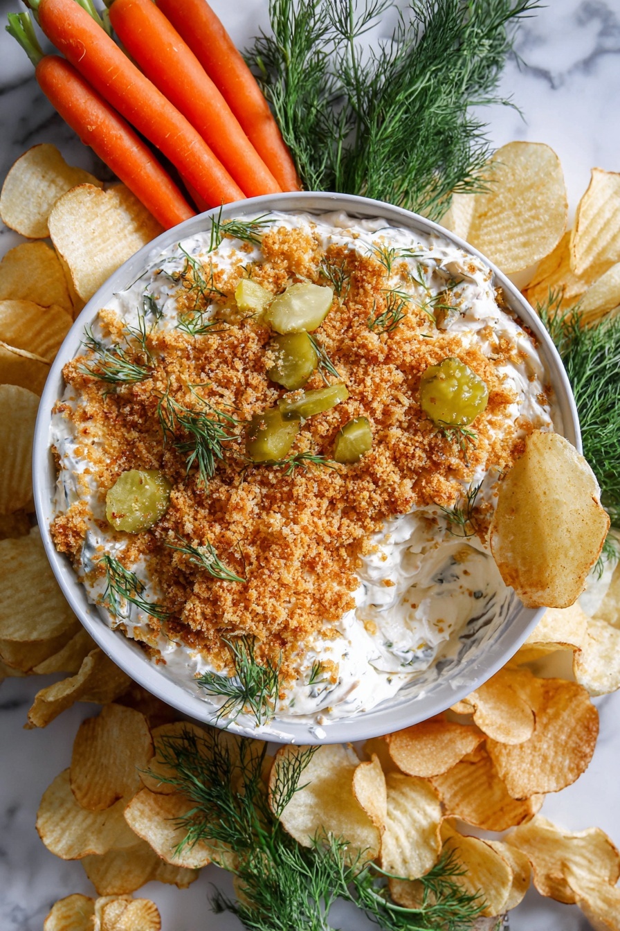 Fried Pickle Dip, fried pickle dip recipe, crispy pickle dip, tangy appetizer, party dip ideas - A white bowl filled with a creamy white dip topped with a thick layer of golden brown crumbs, scattered pickles, and sprigs of fresh green dill. The dip has scoops taken out, revealing the creamy texture beneath the crumb topping. Around the bowl, there are light golden crinkled potato chips placed on a white marbled surface, along with a small bunch of bright orange baby carrots on one side and fresh green dill sprigs on another side. The whole arrangement sits on a white marbled texture. photo taken with an iphone --ar 2:3 --v 7