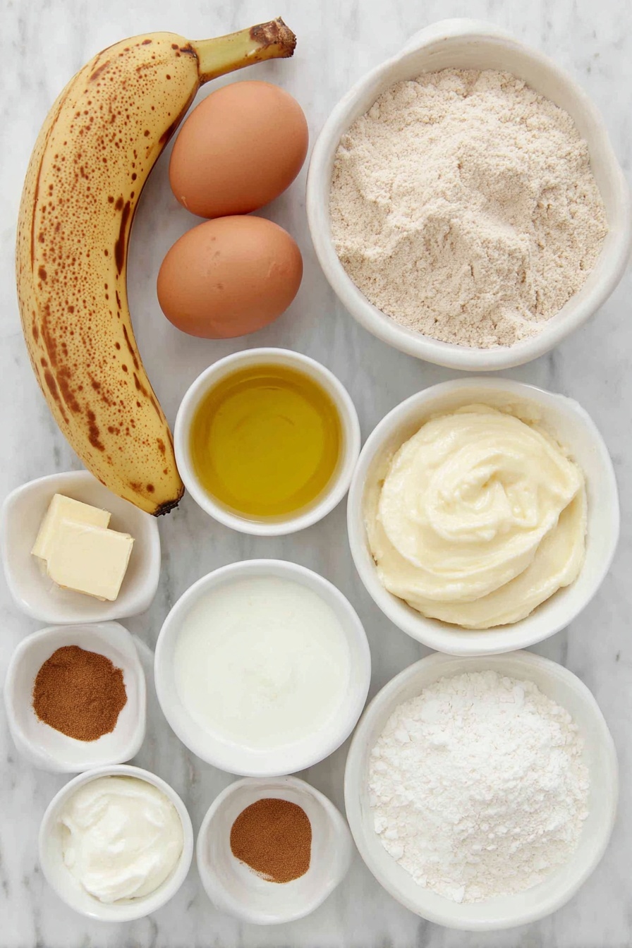 Whole Wheat Banana Bread with Cinnamon Crunch, healthy banana bread recipe, easy whole wheat banana bread, cinnamon topping banana bread, moist banana bread with crunch - Flat lay of two large brown eggs with clean shells, a small bunch of ripe bananas with brown spots (one peeled showing mashed texture), a small white ceramic bowl of light golden oil, a small white bowl of creamy Greek yogurt, a small white bowl filled with whole wheat flour, a small white bowl of fine white cornstarch, a small white bowl of ground cinnamon powder, a small white bowl of light brown sugar, a small white bowl of soft pale butter, and a small white bowl of fine salt crystals, all ingredients arranged symmetrically in simple white ceramic bowls and plates, placed on a clean white marble surface, soft natural light, photo taken with an iPhone, professional food photography style, fresh ingredients, white ceramic bowls, no bottles, no duplicates, no utensils, no packaging --ar 2:3 --v 7 --p m7354615311229779997