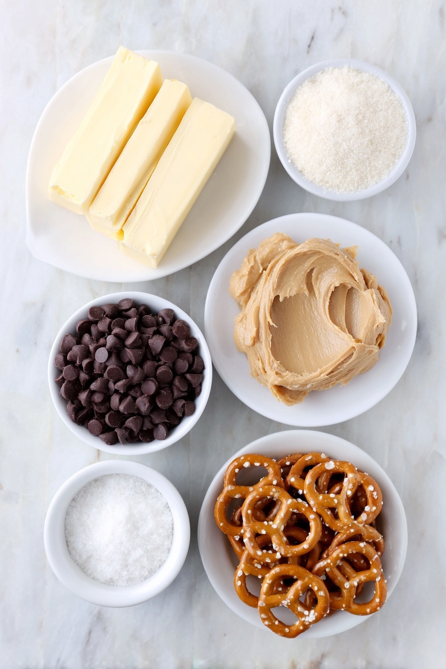 Chocolate-Dipped Peanut Butter Pretzel Bites, sweet salty snack, no-bake treat, chocolate peanut butter bites, easy party snacks - Flat lay of a small mound of creamy peanut butter on a white ceramic plate, a few sticks of salted butter slightly softened on a simple white dish, a small white bowl filled with granulated white sugar, a tiny white bowl holding fine sea salt, a small white bowl of powdered sugar, a neat pile of golden mini twist pretzels arranged next to the bowls, and a small white bowl filled with glossy dark chocolate chips, all placed on a clean white marble surface, soft natural light, photo taken with an iPhone, professional food photography style, fresh ingredients, white ceramic bowls, no bottles, no duplicates, no utensils, no packaging --ar 2:3 --v 7 --p m7354615311229779997