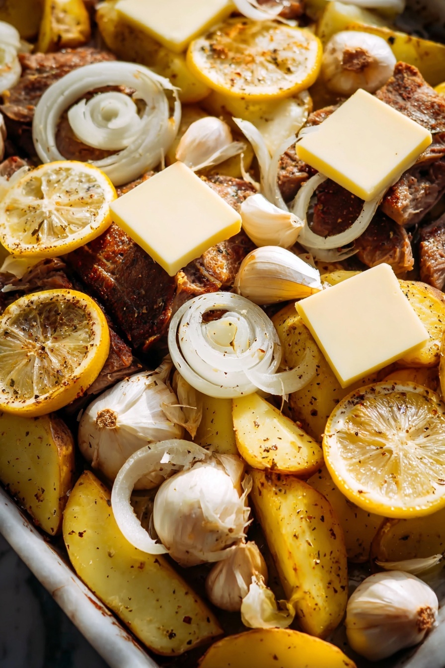 Greek Garlic Butter Chicken Sheet Pan, Greek Chicken Dinner, Easy Greek Sheet Pan Recipe, Mediterranean Chicken Recipes, One-Pan Chicken and Potatoes - The image shows a close-up of a cooked dish with several layers. The bottom layer is pieces of brown roasted meat, and around it are yellow potato wedges with black pepper. On top of the meat and potatoes are thin white onion slices spread evenly. There are slices of bright yellow lemon placed in different spots, along with some whole garlic bulbs. Over the top are several square slices of pale yellow cheese, resting on the lemon slices and meat. The dish sits on a white marbled surface, and the lighting makes the food look warm and tasty. photo taken with an iphone --ar 2:3 --v 7