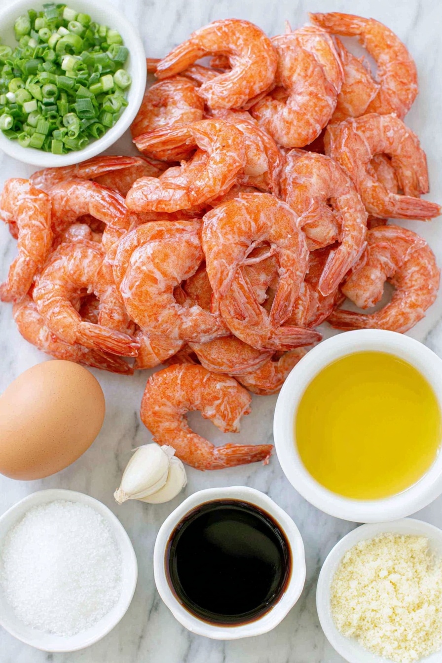 Crispy Shrimp Balls, shrimp snack recipes, easy appetizer ideas, crunchy seafood bites, homemade shrimp appetizer - Flat lay of raw peeled and deveined shrimp, a small bowl of panko breadcrumbs, a whole uncracked brown egg, finely chopped green onions scattered loosely, two peeled garlic cloves, a small pile of grated fresh ginger, a small white bowl of dark soy sauce, a small white bowl of golden sesame oil, a small pile of coarse salt, a small pile of whole black peppercorns, a small handful of chopped fresh cilantro, a small pile of white cornstarch powder, and a small white bowl of clear vegetable oil placed on a clean white marble surface, soft natural light, photo taken with an iPhone, professional food photography style, fresh ingredients, white ceramic bowls, no bottles, no duplicates, no utensils, no packaging --ar 2:3 --v 7 --p m7354615311229779997