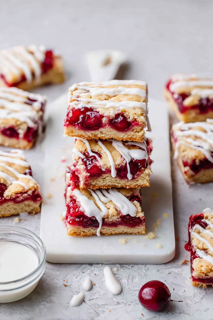Cherry Pie Bars, Cherry Pie Bars Recipe, Easy Cherry Bars, Cherry Dessert Bars, Homemade Cherry Bars - The image shows two stacked square pieces of cherry dessert bars on a white marbled surface. Each bar has three layers: a thick, golden-brown base at the bottom with a crumbly texture, a middle layer filled with bright red whole cherries and thick cherry sauce, and a light golden top layer that looks soft and slightly crumbly. White icing is drizzled generously over the top, dripping down the sides of both bars. Around the main stack, more bars with the same layers and icing sit scattered, with a small clear bowl holding more icing near the corner. The background and surface are white marbled for a clean and bright look. photo taken with an iphone --ar 2:3 --v 7