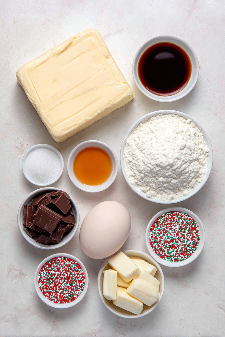 Valentine Chocolate Dipped Cookie Bites, chocolate dipped cookies, Valentine's Day dessert, cookie bites with chocolate, festive cookie treats - Flat lay of a large square of pale yellow unsalted butter, a small white ceramic bowl filled with granulated white sugar, a small white ceramic bowl holding clear golden vanilla extract, a few coarse white salt crystals scattered neatly, one large smooth whole egg with a clean shell, a small mound of fine white all-purpose flour, a small white ceramic bowl filled with shiny dark brown chocolate melting wafers, a small white ceramic bowl with smooth creamy white chocolate melting wafers, and a small heap of colorful round nonpareils, all arranged with perfect symmetry on a clean white marble surface, soft natural light, photo taken with an iPhone, professional food photography style, fresh ingredients, white ceramic bowls, no bottles, no duplicates, no utensils, no packaging --ar 2:3 --v 7 --p m7354615311229779997